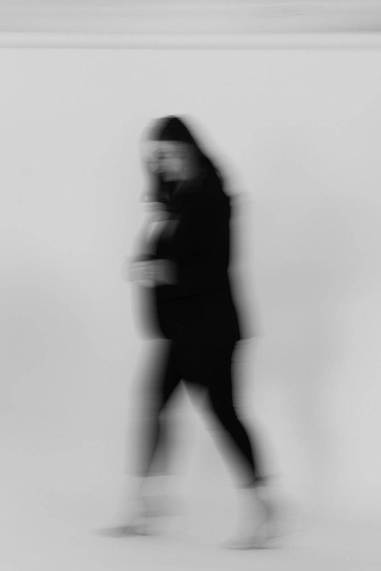 Blurred black and white shot of Magi walking.